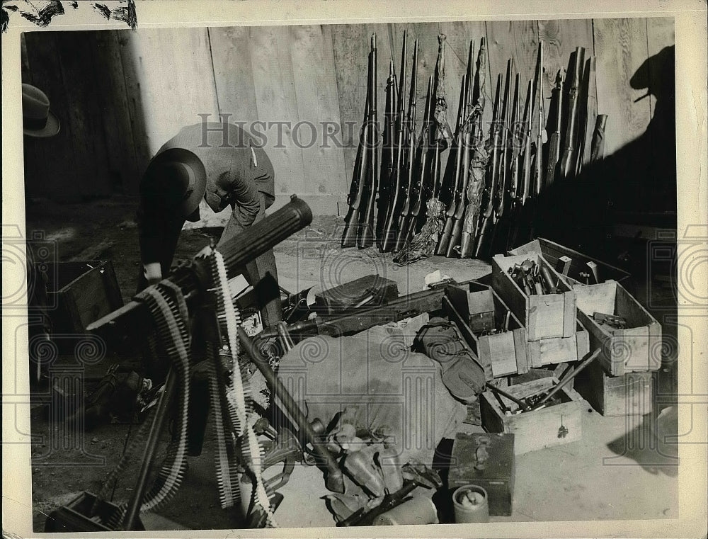 1930 View Of Guns Against Wall And On Floor In Room  - Historic Images