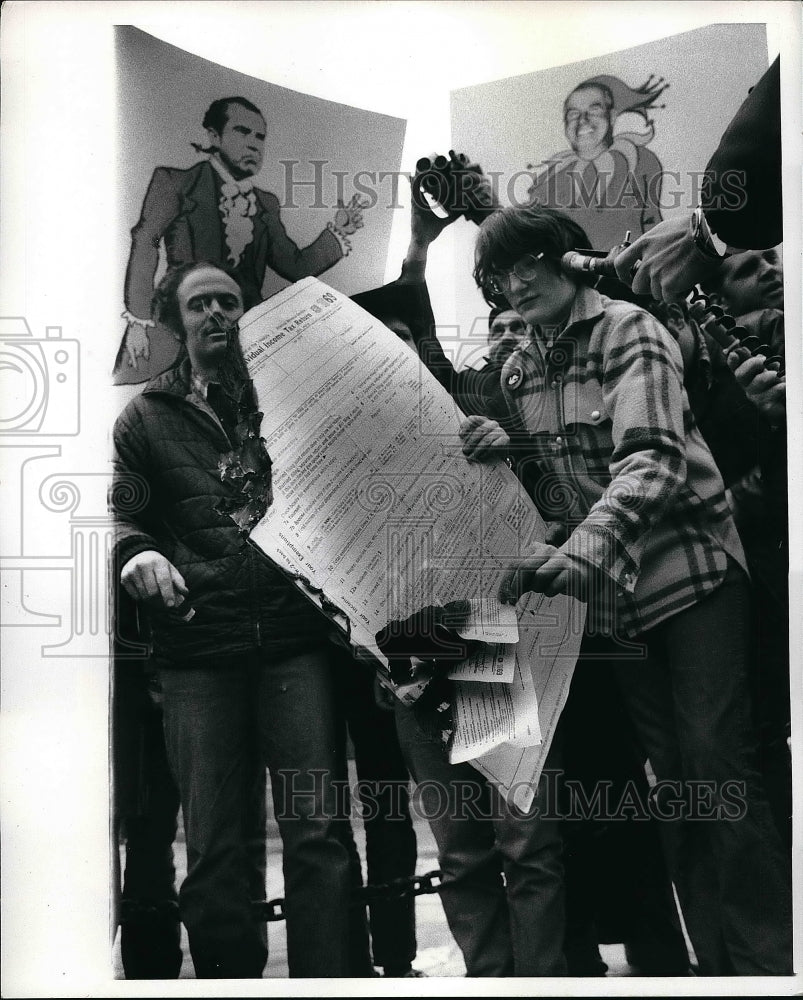 1970 Protesters Burn Huge Tax Form In New York's Battery Park - Historic Images