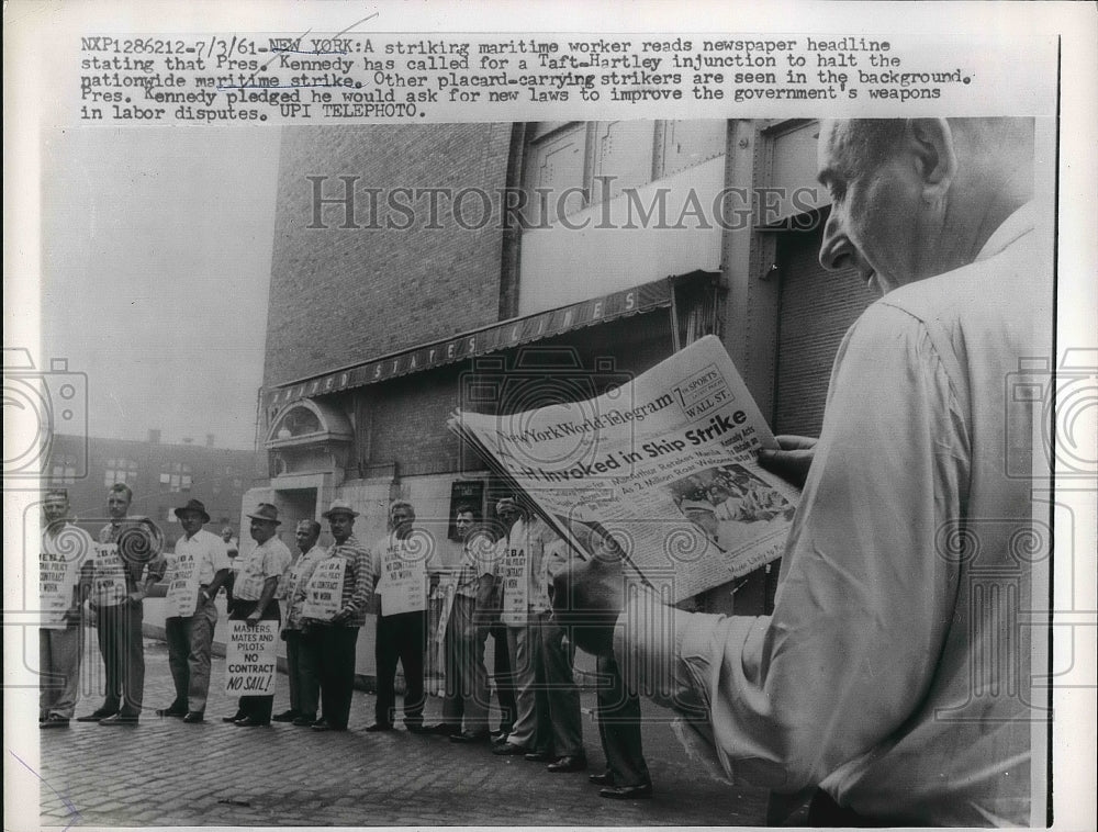 1961 Maritime Strike Worker Reads Newspaper Headlines  - Historic Images