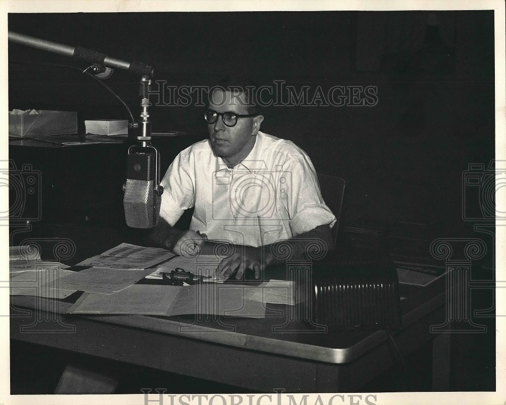 Bill Randle working on paperwork at his desk  - Historic Images