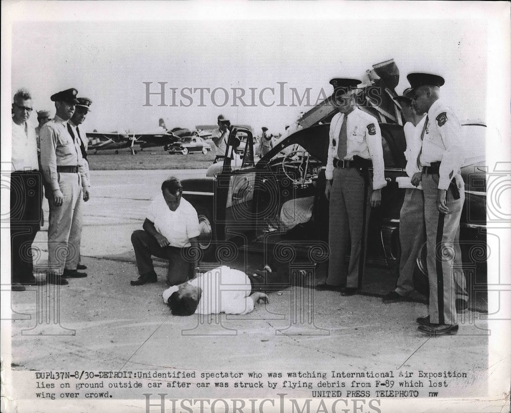 1962 Unidentified spectator who was struck by wing lost by plan - Historic Images