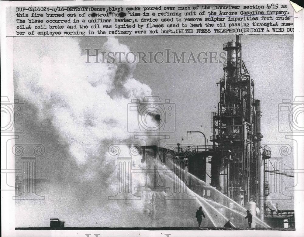 1955 Firefighters putting out fire at refining unit in gas company - Historic Images
