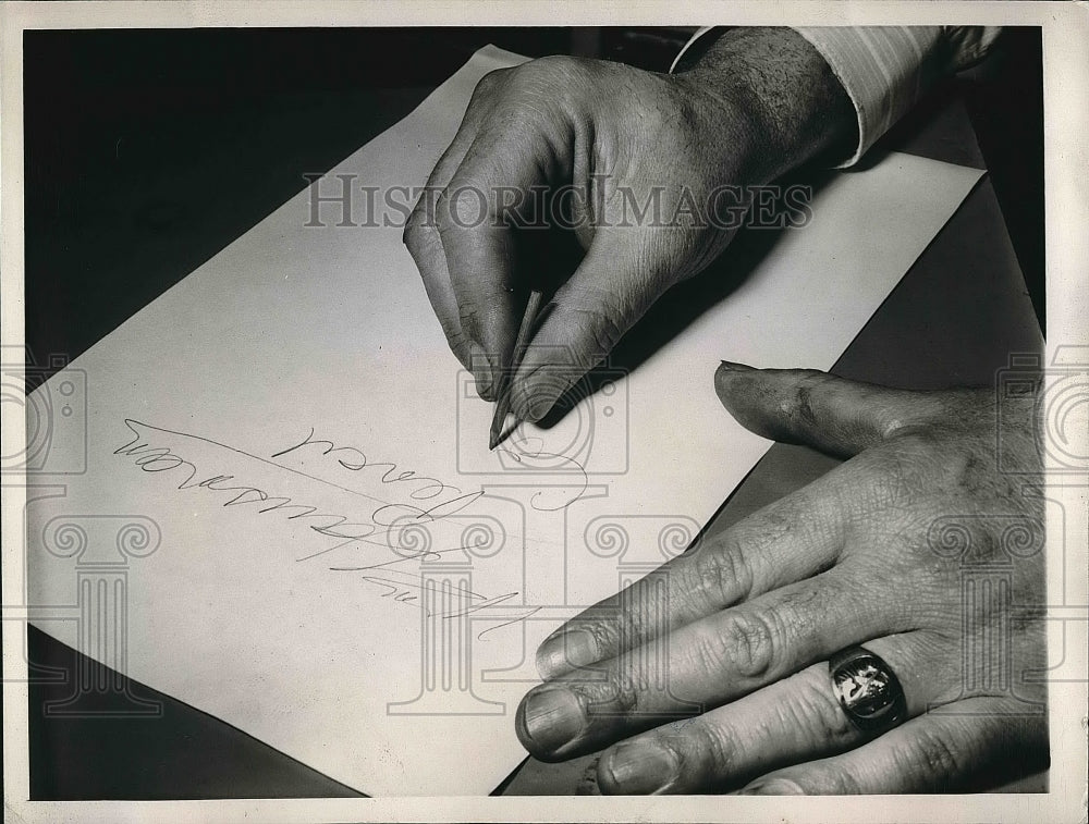 1944 William Hausmann using the smallest commercial pencil ever made - Historic Images