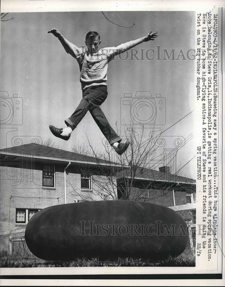 1962 Steve Grim bouncing on an airplane innertube  - Historic Images