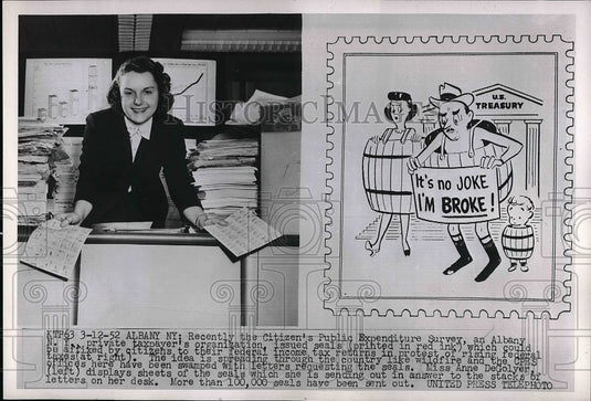 1958 Miss Anne DeGolyer displaying new stamp  - Historic Images