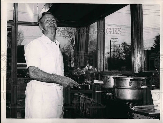 1956 Press Photo Alexander Grieve cooking food - Historic Images