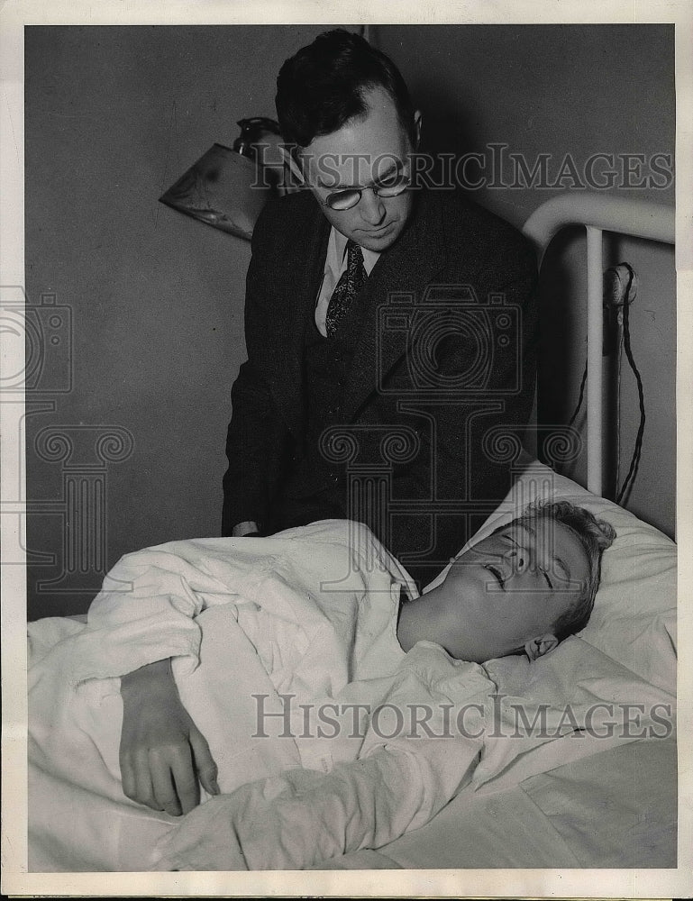 1936 Russell Sutliffee Unconsciou after accident and father Clarence - Historic Images