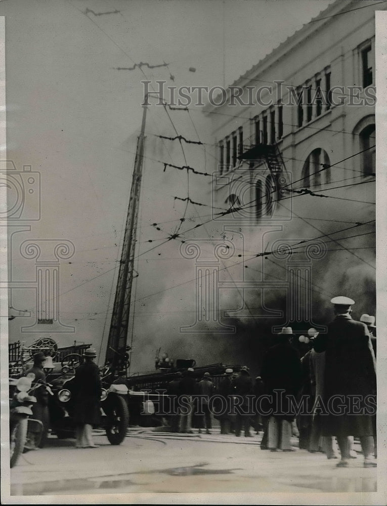 1934 Press Photo Firefighters trying to put out building fire - nea57170 - Historic Images