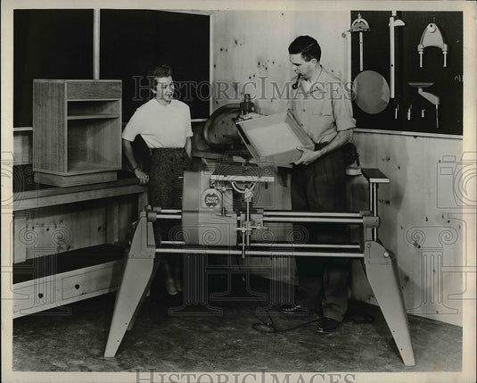 1954 Press Photo Two people showing grinder in Hobby show - nea57297 - Historic Images