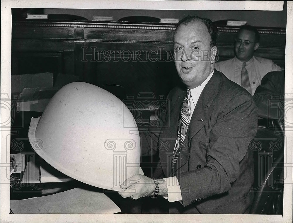 1946 Lester Kelsey holding up antenna shield  - Historic Images