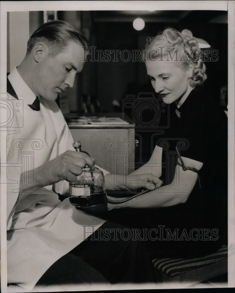 1939 L.C. Williams drawing blood from Rosemary Brummel  - Historic Images