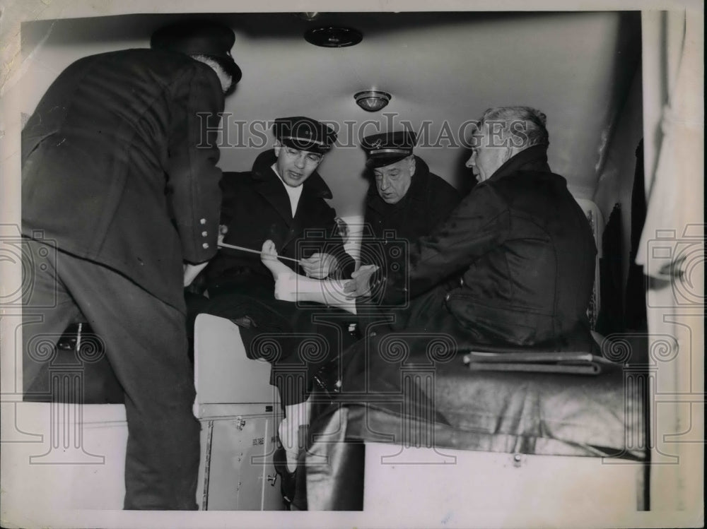 1937 Three Men Tending to Man with Injured Foot  - Historic Images