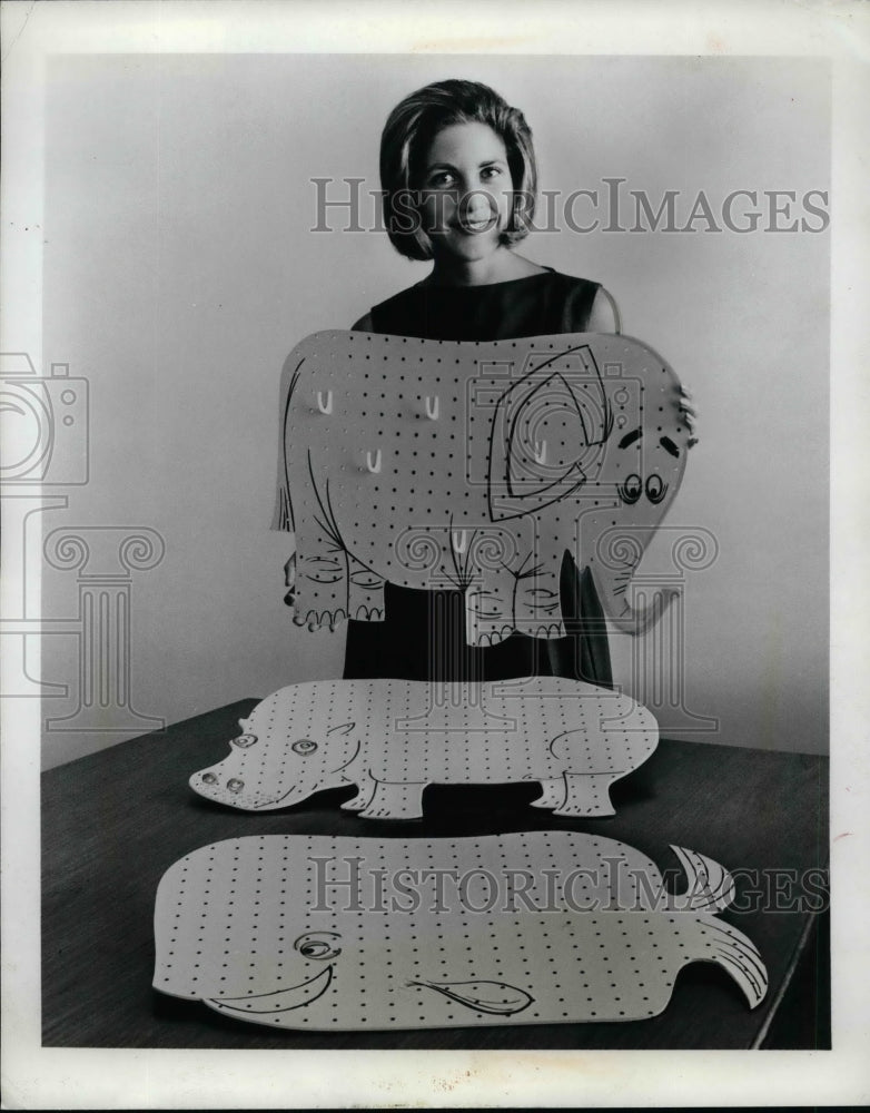 An unidentified woman showing animal crafts  - Historic Images