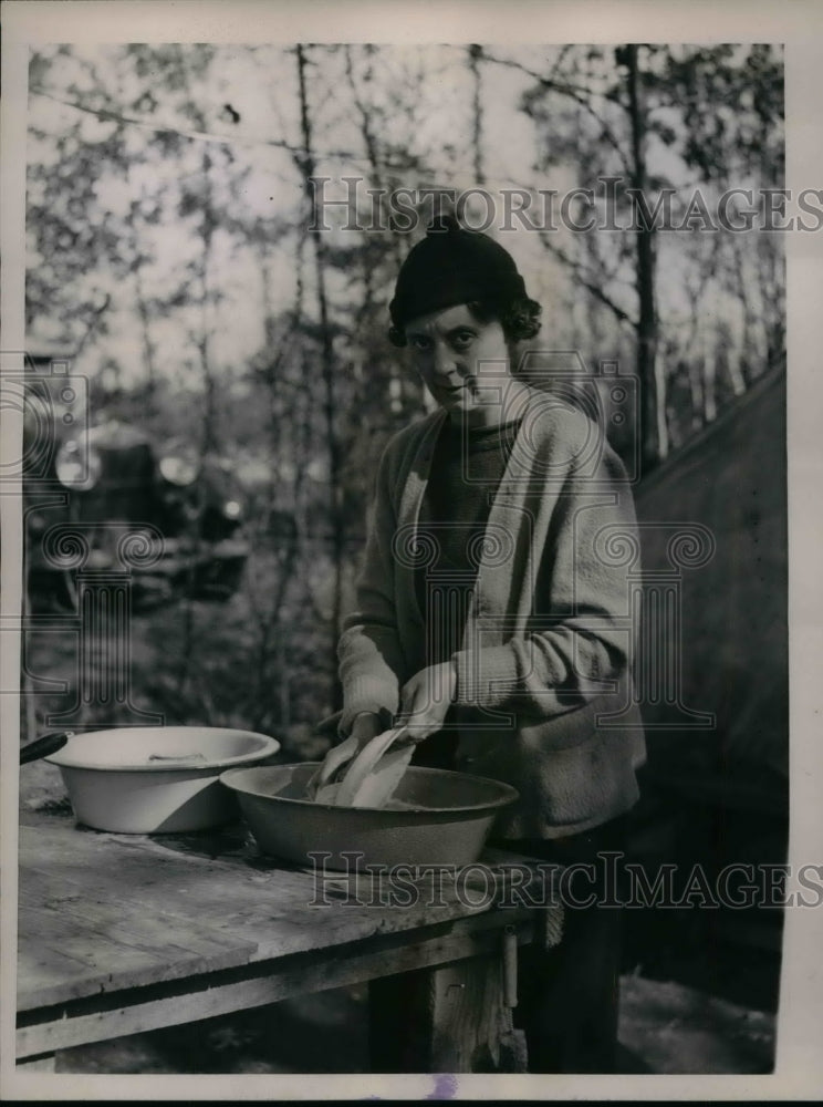 1936 Mrs Homer Fogle washes dishes outdoors  - Historic Images