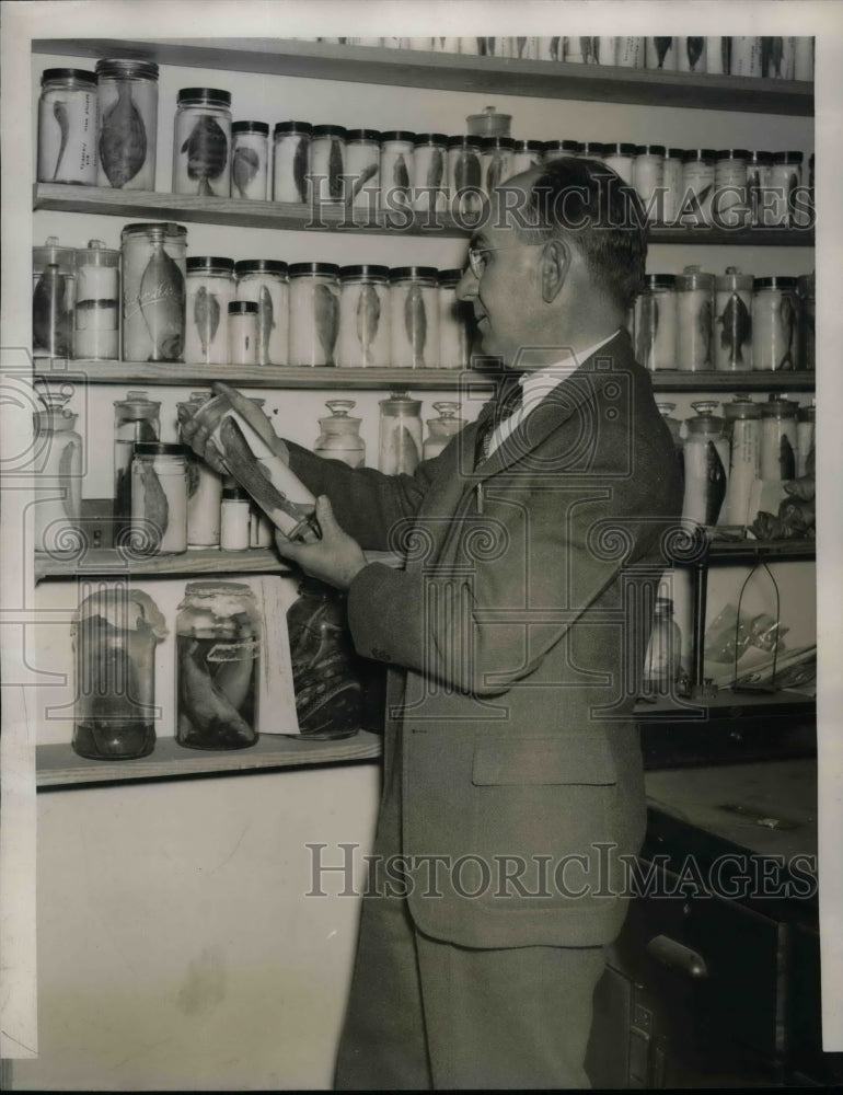 1940 Jeff McCord Fisherman Pickles His Catches  - Historic Images