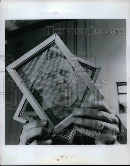 Unknown Man Peers Through Two Screens  - Historic Images