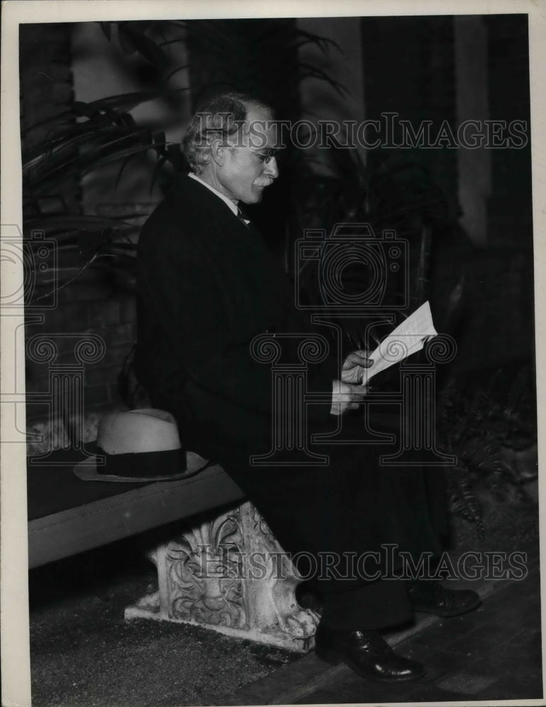 1936 A man sits in church.  - Historic Images