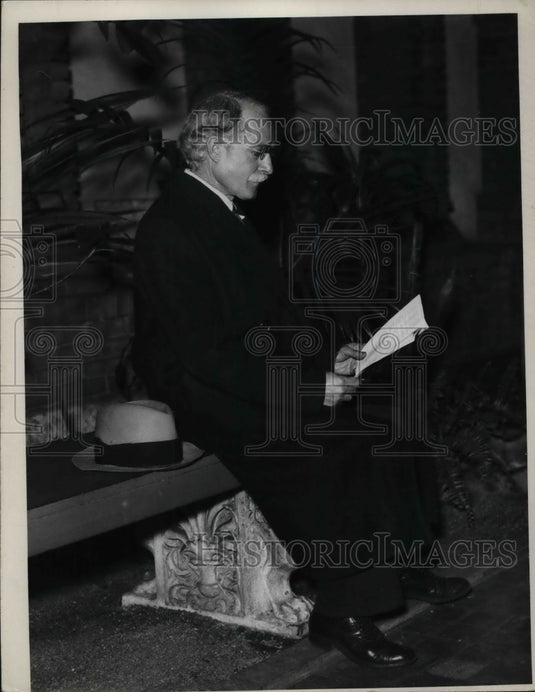 1936 A man sits in church.  - Historic Images
