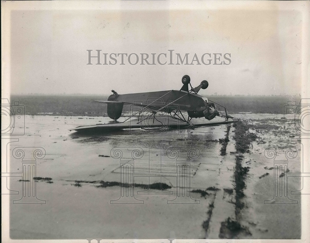 1938 Press Photo Small Plane Tied Down To Runway During Storm Warning - Historic Images