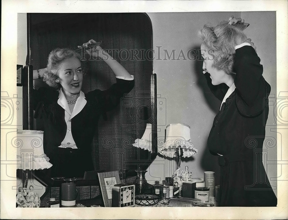 1943 Miss Stanley Fixes Coiffure In Her Mirror  - Historic Images