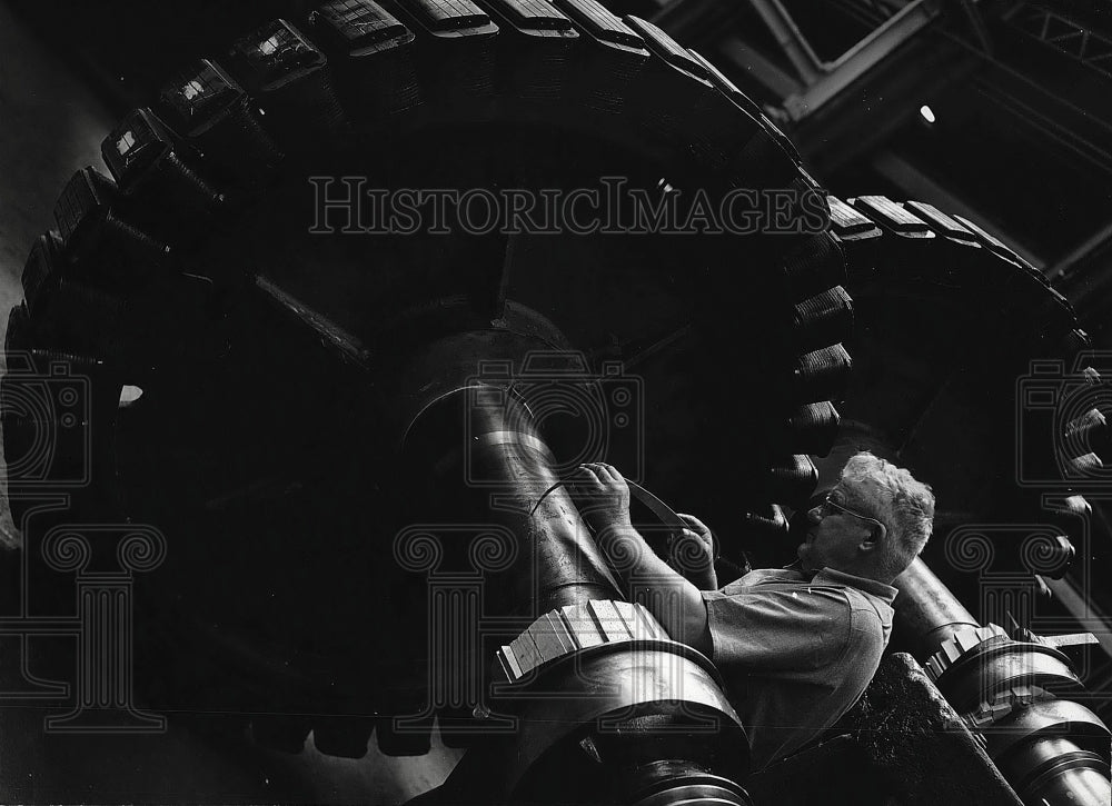 1945 Worker Checking Shaft Diameter of Synchronous Motor Field - Historic Images