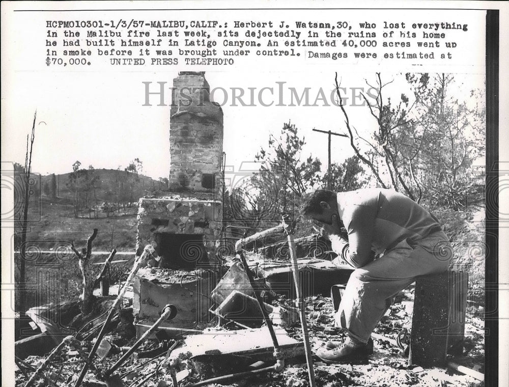 1957 Herbert J. Watson Sits in Remains of His Malibu Home After Fire - Historic Images