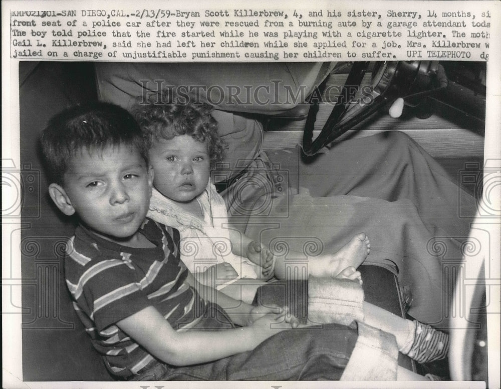 1959 Press Photo Sherry &amp; Bryan Killerbrew rescued from burning car started by - Historic Images