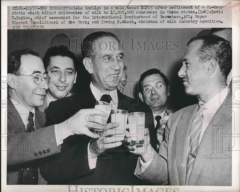 1951 Officials indulge in milk toast after 24hr strike ends that - Historic Images