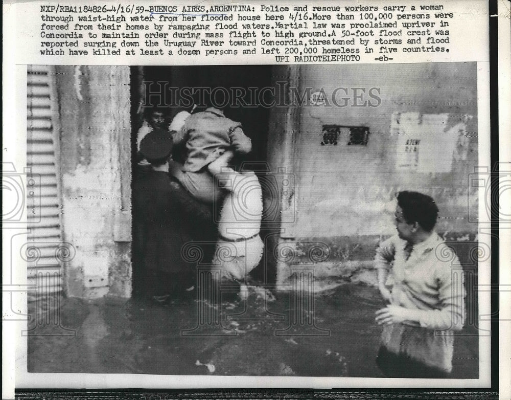 1959 Press Photo Men Rescue Woman Trapped In Flood In Buenos Aires, Argentina - Historic Images