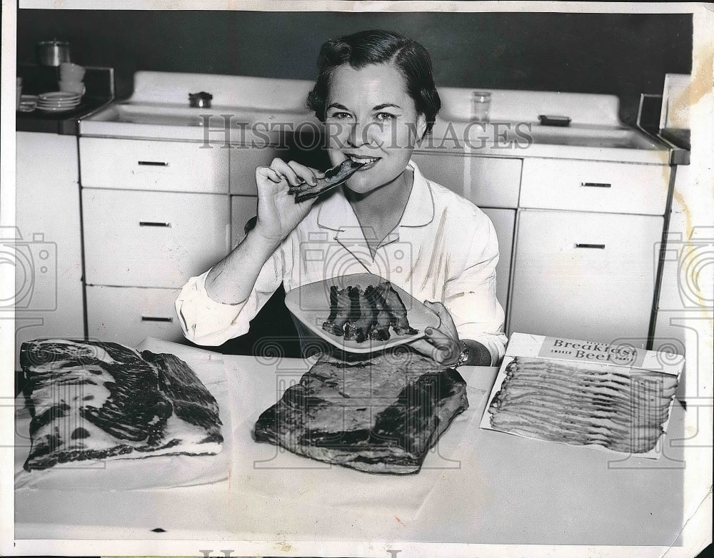 1955 Rita Holmberg Samples Bacon At Armour Packing Plant  - Historic Images