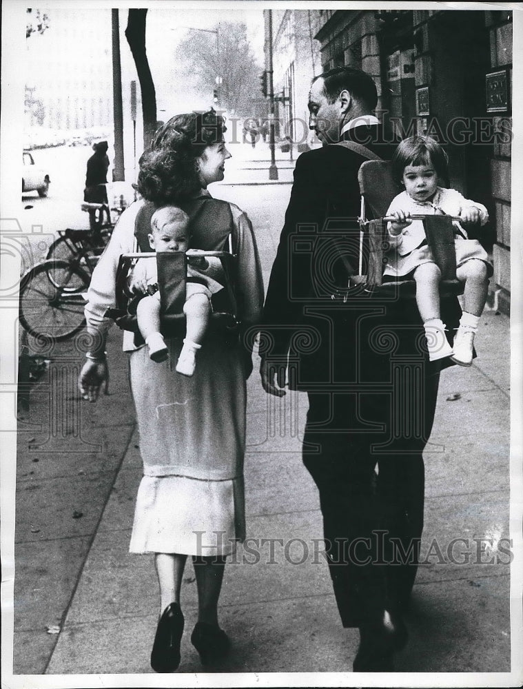 1960 Mr &amp; Mrs Edward Remington With Children on their Backs - Historic Images