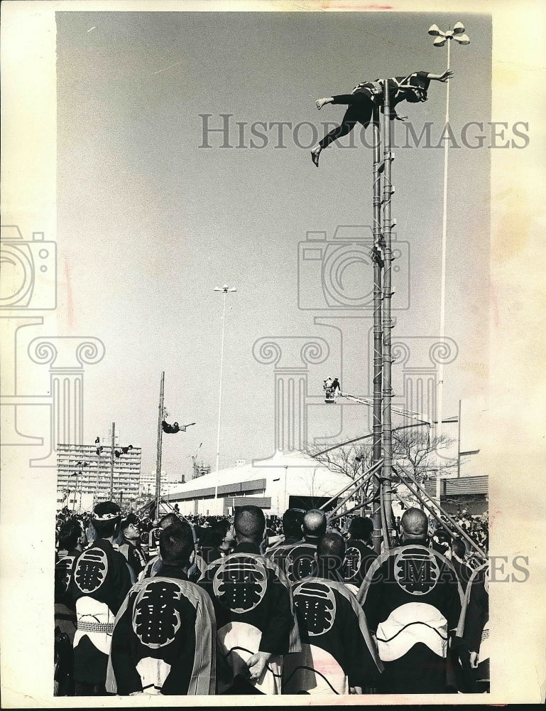 Japanese volunteer firefighters demonstrate acrobatics in Tokyo - Historic Images