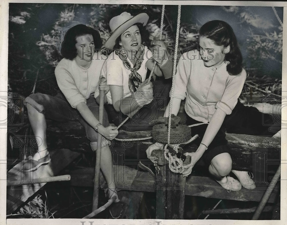 1940 Abbit Quinn, Ar McFadden and Doris Evans tying rope  - Historic Images