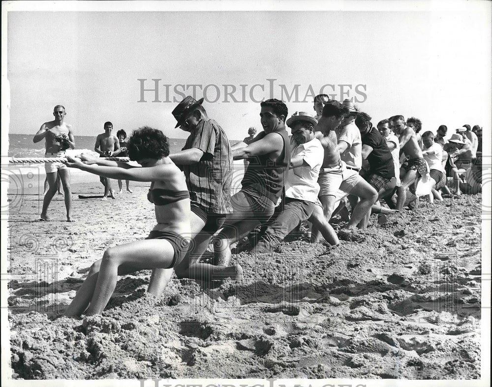 1962 Group of people playing tug - Historic Images