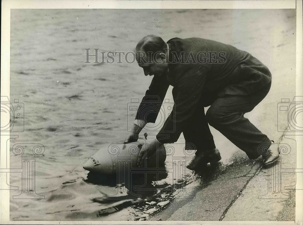 1930 Charles Quaschnewski testing out boat design  - Historic Images