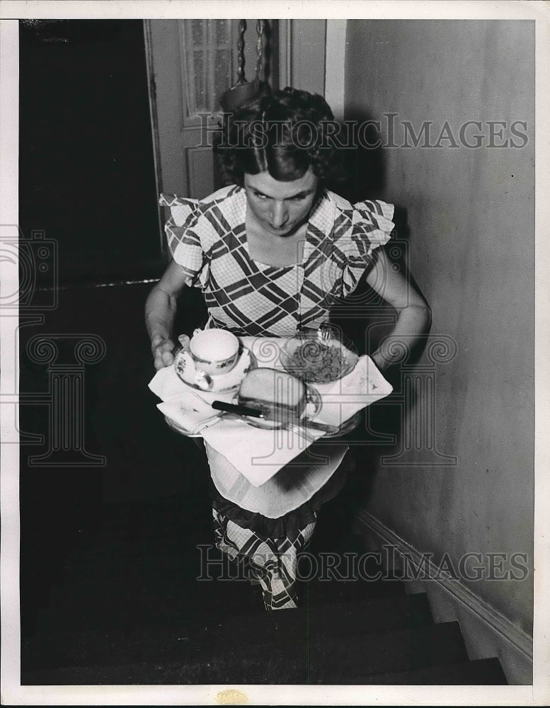 1937 Mrs. William Hayes carrying food upstairs - Historic Images