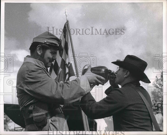 1956 Peter Van Dexter and John Welcon share water.  - Historic Images