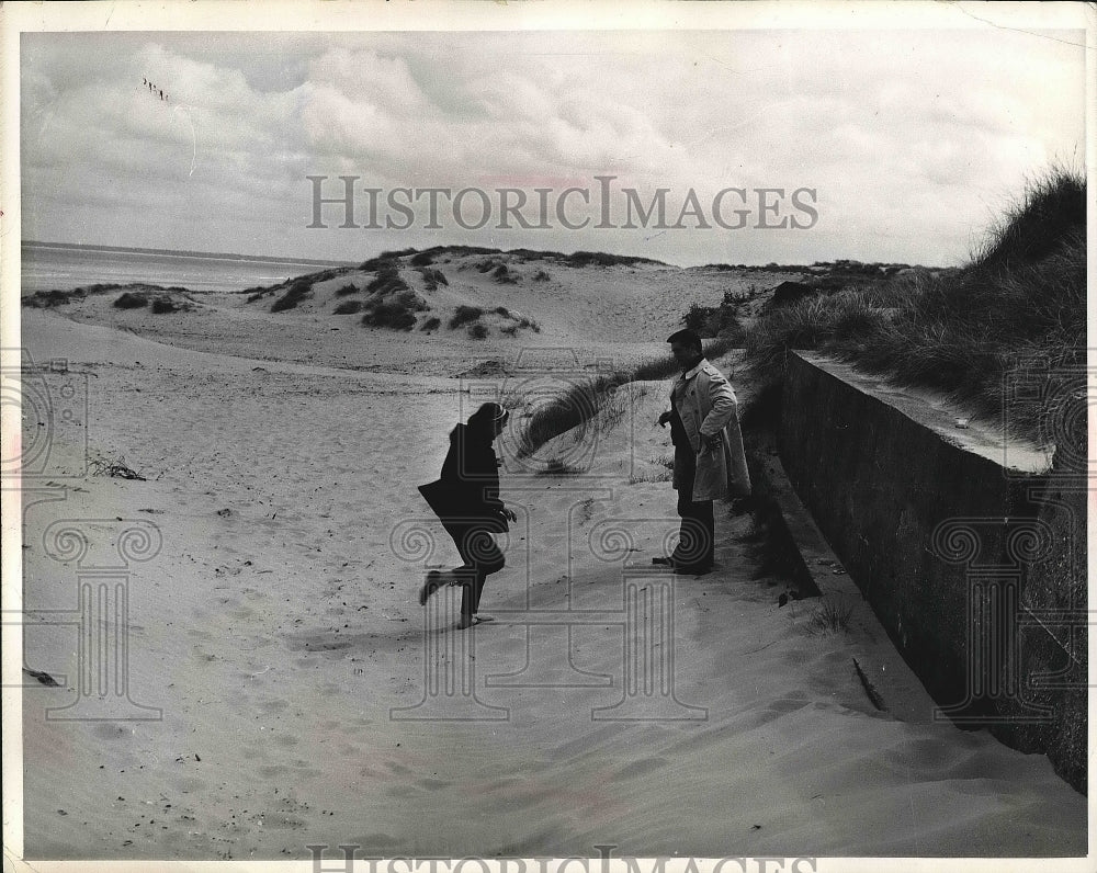 1964 French Couple Walk Along Utah Beach  - Historic Images