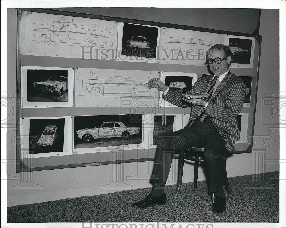 Man with photos of a car  - Historic Images