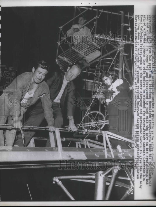 1962 Joe Garcia talked out of jumping by Father Gonzalez in Austin - Historic Images