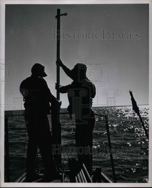 1950 Press Photo Shell Oil Company Crewmen Working on Boat with Shot Hole - Historic Images