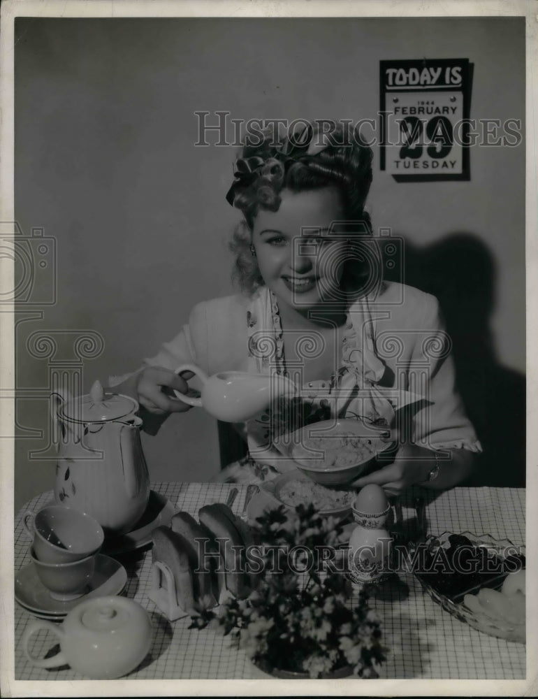 1944 Press Photo &quot;Leap Year&quot; girl having a hearty breakfast - Historic Images