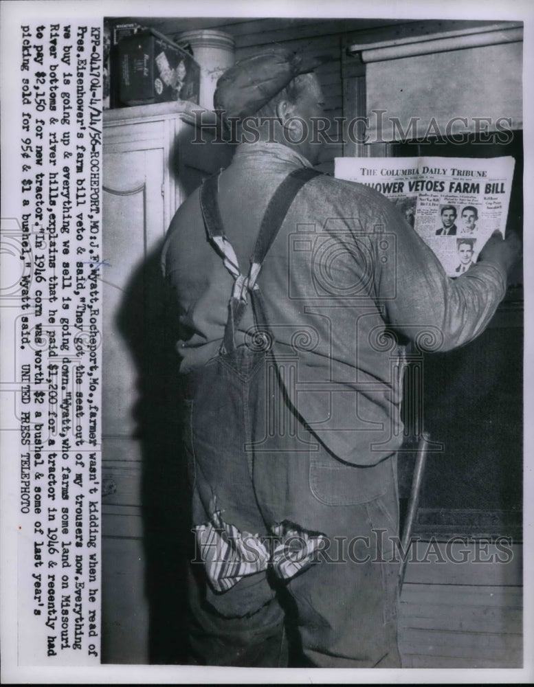1956 J.F. Wyatt, Mo. farmer reads of Eisenhoer's farm veto bill - Historic Images
