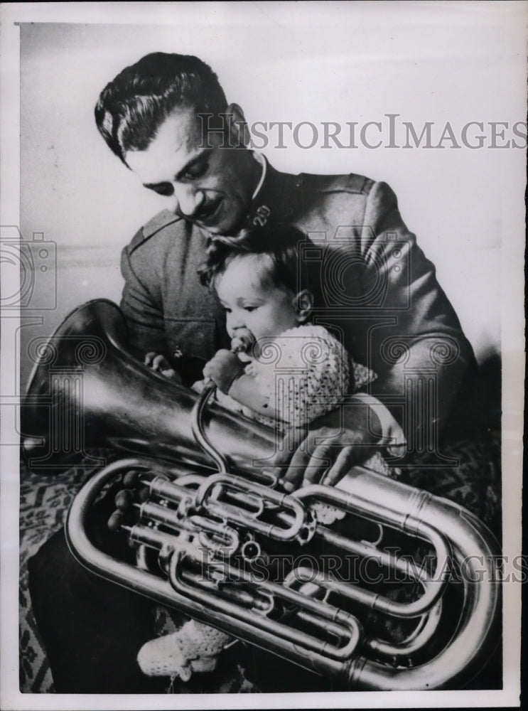 1952 Lazaros Gonatas member of Athens Police Band holds tuba for son - Historic Images