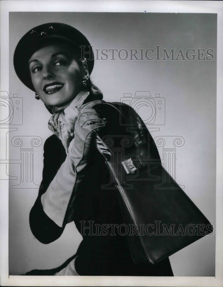 1947 Josef designed elongated bag of fine calfskin w/ narrow double - Historic Images