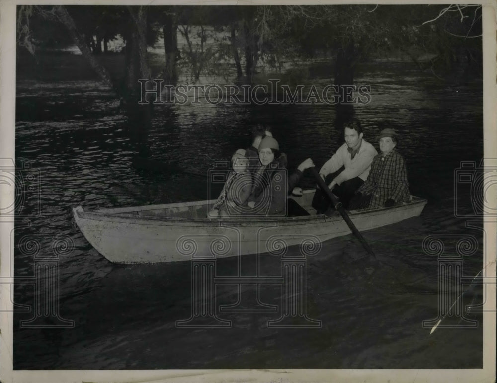1937 Family Hitches Ride In Boat In Northern California Floods - Historic Images