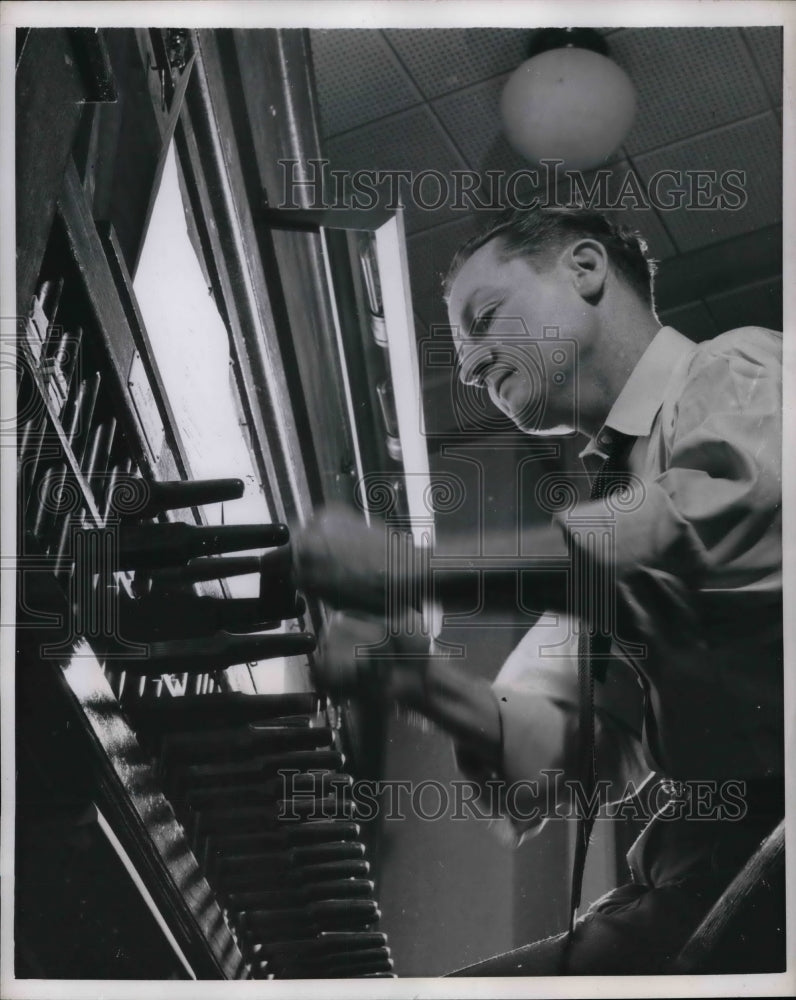 1957 A man playing the Carillion.  - Historic Images