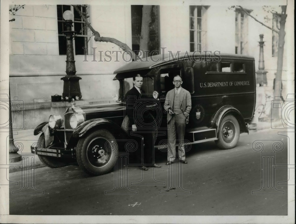 1932 officials standing beside a U.S. Department of Commerce auto - Historic Images