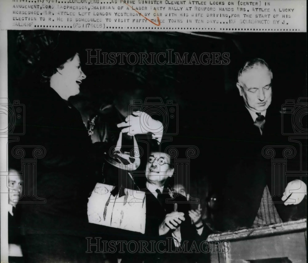 1961 Prime Minister Clement Attlee looks on Lord Lacpherson - Historic Images