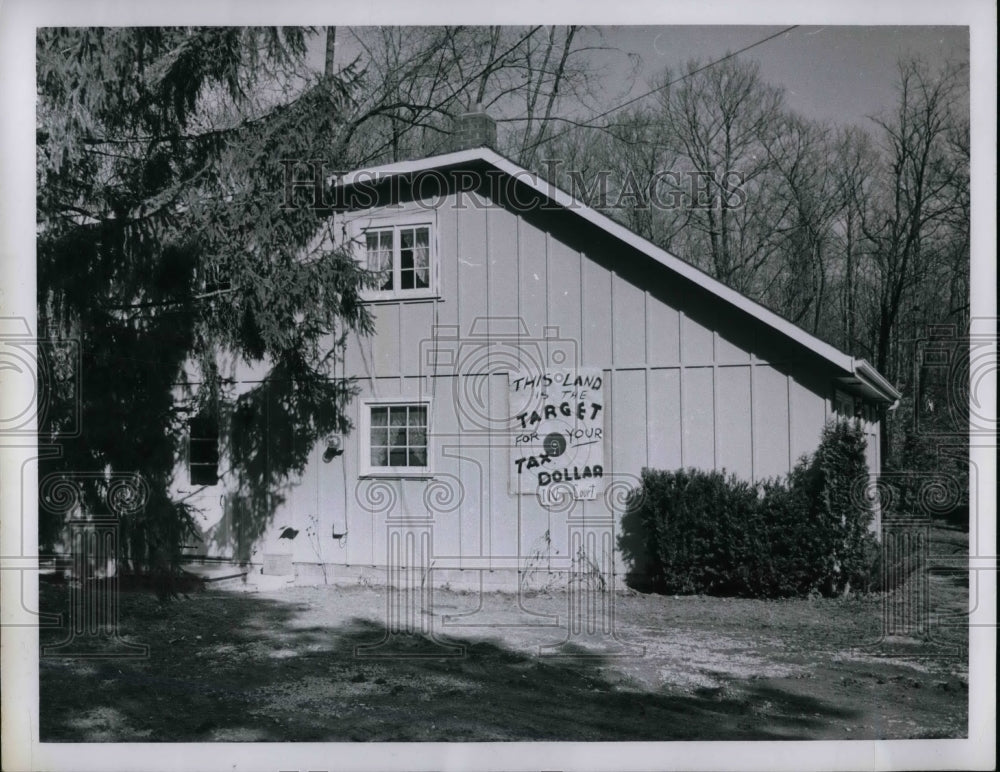 House With Sign Saying &quot;This Land is the Target for Your Tax Dollar&quot; - Historic Images